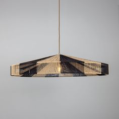 a hanging light made out of woven material