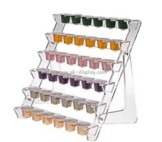 a display rack filled with cups and sauces