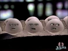 five eggs with faces are lined up in a row