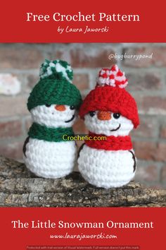 two crocheted snowmen sitting on top of a tree branch