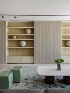 a living room filled with furniture and shelves