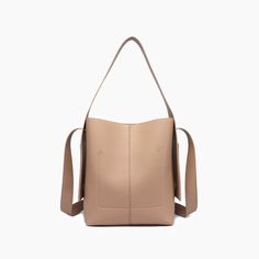 The Desert Dreamer Vegan Tote Bag has understated elegance and versatile design, making it a go-to accessory for the urban nomad. Add a touch of sophistication to any outfit and carry your dreams wherever you go. 100% Vegan Leather 12"W * 13"H * 7"D 6" top handle drop 22" detachable chain link Pull magnetic closure 16.50 oz Style# U2CN07 Versatile Tote Satchel For On-the-go, Beige Top Handle Box Bag For On-the-go, Modern Bucket Bags For On-the-go, Beige Box Bag With Detachable Handle For On-the-go, Chic Square Bucket Bag For On-the-go, Everyday Taupe Hobo Satchel Bag, Taupe Hobo Bag Satchel Style, Versatile Square Box Bag For On-the-go, Beige Double Handle Satchel For On-the-go