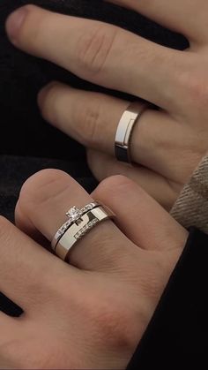 two people with wedding rings on their hands