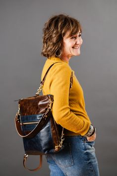 Our Everyday Collection of handbags reflects our task, offering tried + true styles + combinations that are timeless + classic. Colors + sizes to keep up with your effortless style + quality that holds up to your everyday adventures. Our backpack is perfect for your heavier loads. Tote on your shoulder or clip on the backpack straps for a hands-free carry! Give your “purse shoulder” a break and share the load with the Backpack. Makes a perfect diaper bag too! The choice is yours! Available in Ro Versatile Leather Backpack For Daily Use, Daily Use Backpack With Leather Handles As Shoulder Bag, Standard Backpack With Zipper Pocket For Everyday Use, Daily Use Satchel Backpack With Gold-tone Hardware, Daily Use Backpack Shoulder Bag With Gold-tone Hardware, Rectangular Leather Backpack With Gold-tone Hardware For Travel, Rectangular Leather Backpack With Gold-tone Hardware For Daily Use, Rectangular Leather Backpack With Gold-tone Hardware, Everyday Adventures