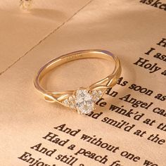 a ring sitting on top of an open book