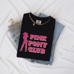 This Comfort Colors unisex t-shirt delivers ample comfort and a laidback, one-of-a-kind style to members of the Pink Pony Club. It's the perfect concert outfit for the 2024 Midwest Princess tour or Pink Pony Girl. 💖 Rather have a Pink Pony Club crop top? Check it out: https://bottledlightningdsn.etsy.com/listing/1736320750 🎠 Unique Pink Pony Club block text and cowgirl silhouette printed on the front only in shades of pink. Pigment dyes provide a vintage look that will remain for the life of t Unisex Pink T-shirt With Band Merch, Pink Screen Print T-shirt For Concert, Pink T-shirt With Screen Print For Concert, Unisex Pink Band Merch T-shirt, Pink Letter Print T-shirt For Concert, Ring-spun Cotton Graphic Tee, Cowgirl Silhouette, Pink Pony Club, Midwest Princess