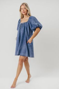 The Morgan Mini Dress is a summer essential -- she's quirky, on-trend, and (thanks to her 100% cotton construction), incredibly comfortable. We love how easy it is to dress this mini up with wedges and accessories, or dress it down with tennies or slides for a day of shopping or sightseeing. You don't want to miss out on this unique addition to your closet! FIT: Runs true to size - relaxed fit. MATERIAL: 100% Cotton. GARMENT DETAILS: Cotton denim mini dress with a swing silhouette and square, el Dark Wash Denim Mini Dress For Day Out, Chic Mini Dress With Relaxed Fit, Chic Relaxed Fit Mini Dress, Chic Relaxed-fit Mini Dress, Trendy Dark Wash Mini Dress For Day Out, Cotton Mini Dress For Spring And Summer, Cotton Mini Dress For Spring, Cotton Mini Dress For Summer Day Out, Chic Dark Wash Mini Dress For Day Out