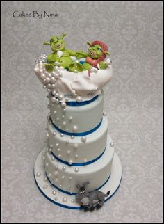 a three tiered cake decorated with the characters from the grinen movie