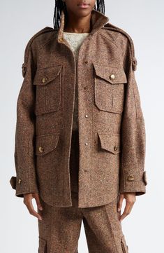 Oversized proportions define this nubby tweed field jacket tailored with double-layer epaulets draping over the roomy raglan sleeves. Antiqued brass sunray buttons accent the utility pockets and adjustable belted cuffs. 30" length (size Medium) Hidden magnetic-snap closure Stand collar Adjustable button-tab cuffs Chest button-flap patch pockets; front button-flap pockets Button epaulets Lined Dry clean 30% wool, 25% recycled polyester, 25% polyester, 15% silk, 5% other fibers Made in Portugal De Tweed Outerwear With Flap Pockets For Work, Brown Tweed Jacket With Flap Pockets For Fall, Fall Brown Tweed Jacket With Flap Pockets, Fall Tweed Outerwear With Flap Pockets, Utility Pockets, Field Jacket, Tweed Jacket, Flap Pocket, Raglan Sleeve