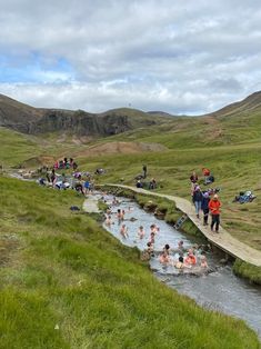 many people are swimming in the river