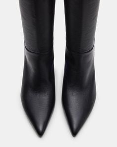 The EDEN boot features a pointed toe and knee-high design, providing a stylish and sophisticated look. These boots are durable and comfortable, making them a great addition to any wardrobe. Elevate your outfit with these elegant and versatile boots. 2.25 inch heel height Size 6 measurements: 15.25 inch shaft circumference, 16.5 inch shaft height Size 8 measurements: 16.5 inch shaft circumference, 17.25 inch shaft height Size 10 measurements: 17.75 inch shaft circumference, 18 inch shaft height L The Eden, High Design, Pointed Toe Boots, Higher Design, Spring Tops, Spring Looks, Sweaters Knitwear, Tank Top Cami, Fun Bags