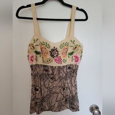 Never Worn Embroidered Tank Top From Anthropologie Size L. Perfect Summer Tank! I Don't Know The Brand. It's Not On The Tag. The Back Has Smocking For Stretch. Please Don't Hesitate To Ask Any Questions. I'm Happy To Answer. Thanks For Looking! Beige Cotton Top With Floral Embroidery, Spring Beige Embroidered Cotton Top, Fitted Embroidered Beach Top, Fitted Top With Multicolor Floral Embroidery, Fitted Cream Tops With Floral Embroidery, Fitted Multicolor Embroidered Top For Spring, Fitted Embroidered Top With Multicolor Embroidery For Spring, Fitted Casual Embroidered Top With Intricate Embroidery, Cream Embroidered Top For Summer