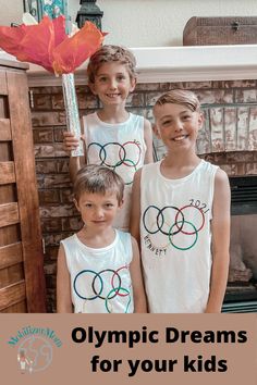 three young boys standing next to each other in front of a fireplace with the words olympic dreams for your kids