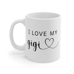 a white coffee mug with the words i love my gigi on it