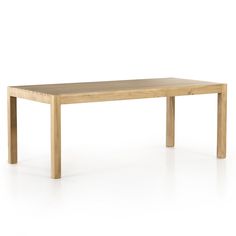 a wooden table sitting on top of a white floor