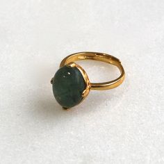 A stunning and large 13mm all natural green-blue moss aquamarine with a very high dome is prong set into a 22k gold over sterling vermeil setting. This stone absolutely glows from every single angle. The size is fully adjustable on the very comfortable band. An absolute one and only fine gemstone ring. Gold Oval Emerald Ring For Everyday Wear, Gold Emerald Ring With Natural Stones For Anniversary, Elegant Gold Emerald Ring With Natural Stones, Gold Emerald Ring With Large Oval Stone, Elegant Gold Emerald Ring With Large Stone, Gold Emerald Cabochon Ring For May Birthstone, Gold Emerald Cabochon Ring Gift, Gold Domed Sapphire Ring Gift, Moss Aquamarine