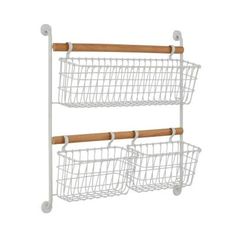 two white wire baskets with wooden handles on each side, one is hanging from the wall