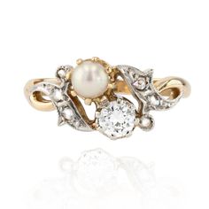 Ring in 18 karat yellow gold. Charming antique you and me ring, it is set with claws on its top, of a brilliant- cut diamond and a small pearly white pearl. On either side, a cornucopia pattern gives the start of the ring and is set with 2x3 rose-cut diamonds. Heightv: 9.1 mm, widthv: 11.5 mm approximatley, thickness : 4.7 mm approximately, width of the ring at the base : 2.1 mm. Total weight of the jewel : 3,6 g approximately. US Size : 7 ; Free resize, please contact us. Authentic antique jewe Antique Wedding Rings Vintage, Pearl Engagement Ring, Gold Pearl Ring, Deco Engagement Ring, Pearl Diamond, Perfect Engagement Ring, Gold Jewelry Fashion, Vintage Engagement Rings, White Pearl