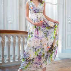 a pregnant woman in a floral print dress