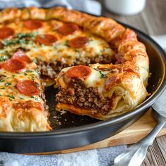 a deep dish pizza with pepperoni and cheese on top, ready to be eaten