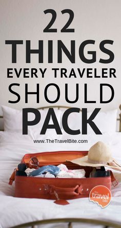 an open suitcase sitting on top of a bed with the words 22 things every traveler should pack