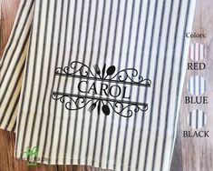 two striped towels with the name carol on them