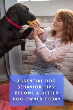 a woman sitting on the floor with her dog and eating something out of her mouth