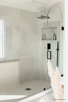 a bath room with a stand up shower