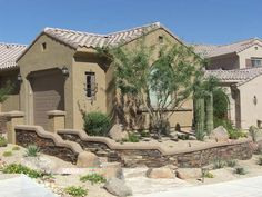 a house with landscaping in front of it