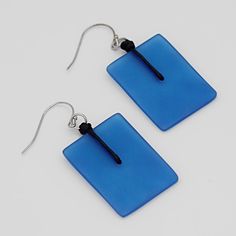 "An easy go-to earring; These dangle earrings feature a translucent blue resin bead that hangs from a silver plated french hook. These earrings can be worn for both formal and casual occasions. Wear alone or with a coordinating necklace; you'll find yourself reaching for these every day. Earrings hang 2.25\" in length Bead is 1.25\"x 1\" Care Instructions Remove jewelry when applying perfumes, creams, washing hands, etc. Do not store in direct sunlight. To restore color and shine, apply a drop o Blue Rectangular Earrings With Ear Wire, Blue Rectangular Earrings, Minimalist Blue Earrings With Ear Wire, Modern Blue Earrings For Everyday, Modern Blue Earrings For Everyday Wear, Modern Light Blue Earrings Gift, Modern Blue Everyday Earrings, Washing Hands, Earrings Acrylic