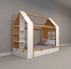 a child's bed with a built in bookcase