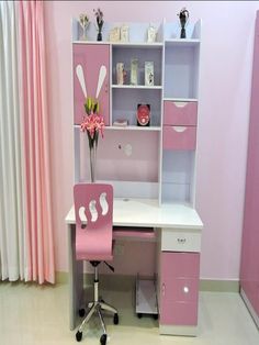 a pink desk and chair in a room