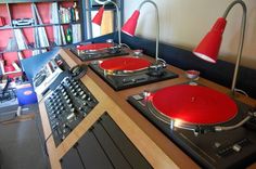 two turntables are sitting next to each other in front of a record player