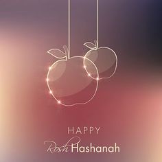 a happy roshanah card with two apples hanging from strings