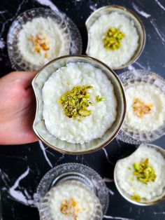 small bowls filled with food sitting on top of a table