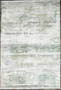 an area rug with green and white colors