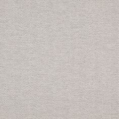 an upholstered area rug with white and grey herringbones