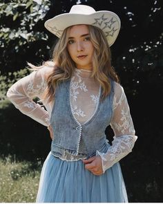 Wild Rose Bohemian Western Lace Top. Long sleeve layering blouse with mock neckline, sheer floral embroidery throughout, stretchy fit, and soft white vintage color.  Feminine and dainty addition to any sleeveless vest or cropped or plunge neckline tops for a dreamy feel and more coverage.  Perfect for lovers of western bohemian style. Make it your choice for a rodeo, bridal cowgirl look, girl's nights,music festivals, trips to Vegas and much more for a unique top that flatters and softens like n Spring Lace Patchwork Tops, Spring Blouse With Sheer Sleeves For Layering, Spring Festival Lace Patchwork Top, Spring Lace Patchwork Top For Festivals, Fitted Blouse With Lace Sleeves For Spring, Fitted Western Style Spring Blouse, Fitted Western Blouse For Spring, Western Style Fitted Blouse For Spring, Fitted Western Style Blouse For Spring