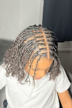 This hairstyle features well-made cornrows that begin at the front of the head and get smaller toward the back, smoothly combining with loose, curly hair at the ends. The difference between the neat, tight braids and the soft, wavy texture makes for an adorable look that's great for kids. It's a style that can be both fun and nice, so it - Click to see more of 20 Cute and Stylish Cornrow Hairstyles for Kids and follow us for more hairstyle ideas. // Photo Credit: Instagram @shankamari.slays Loose Curly Hair, Hairstyles For Kids