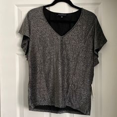 Fun Shimmery Blouse Ready To Wear For A Night Out!! Sleeves Have Some Flutter To Them. Runs A Little Small. V-neck Shimmer Tops For Party Season, Chic Silver V-neck Top, Metallic V-neck Top For Party, V-neck Glitter Top For Party, Metallic Glitter Tops For Evening, Metallic Glitter Top For Evening, Metallic V-neck Top For Night Out, Glitter V-neck Top For Night Out, Gray Tops For Spring Evening