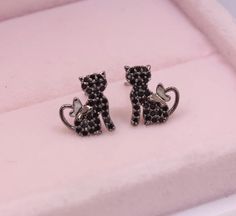 Introducing our gorgeous 14k gold plated kitty cat earrings, completely adorned with twinkly cubic zirconia crystals and a butterfly tail. Simple, timeless, delicate and elegant - a purrrrrrfect gift for any cat lover! Specifications Material: 14k Gold-plate & Cubic Zirconia Colours Available: Silver, Gold or Black Earring Size: Approx 1.3 cm x 0.8 cm Stud Back: Push-back Nickel Free, Hypoallergenic Delivery All deliveries are fully tracked and insured for your peace of mind. Butterfly Cat, Black Earring, Delicate Butterfly, Gold Rush, Cat Earrings, Black Earrings, A Butterfly, Kitty Cat, Cat Lover