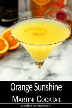 the orange sunshine martini is served in a coupe glass with an orange garnish