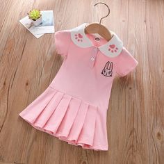 Toddler Girl College Style Polo Collar Dress Wholesale Children's Clothing - PrettyKid Fitted Doll Collar Dress For School, Fitted Pink Dress For School, Playful Fitted Dress For School, Cute Pink School Dress, Pink Cotton School Dress, Pink Cotton Dress For School, Cute Pink Dresses With Cartoon Print, Cute Fitted Dress With Cartoon Print, Pink Short Sleeve Dresses With Cartoon Print