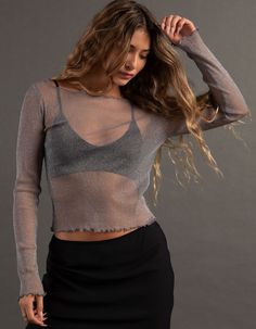 Rsq Metallic Long Sleeve Tee. This Tee Is Crafted From A Sheer Metallic Lightweight Fabric. Boat Neckline. Long Sleeves. Lettuce Edge Trim. 65% Nylon, 35% Metallic. Machine Wash. Imported. Model Is Wearing A Size Medium. Model Measurements:height: 5'7" Bust: 34.5"waist: 27"hips: 38" Fall Sheer Crew Neck Blouse, Scoop Neck Tops For Night Out In Fall, Fall Scoop Neck Top For Night Out, Stretch Long Sleeve Crew Neck Top For Party, Fitted Sheer Top With Scoop Neck, Fall Party Crop Top With Crew Neck, Fall Crew Neck Crop Top For Party, Stretch Crew Neck Top For Party, Fitted Crew Neck Mesh Top For Party