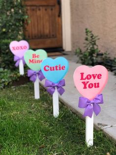 three heart shaped candy lollipops with the words be mine cutie you on them