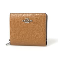 The Coach Women's Small Pebbled Leather Snap Wallet is a compact and stylish accessory perfect for organizing your essentials. Made from refined pebble leather, this wallet features a secure snap closure and elegant silver-tone hardware. The exterior includes a zip coin pocket, while the interior boasts 3 credit card slots, a full-length bill compartment, an ID window, and 2 slip pockets for added convenience. With fabric lining for durability, this wallet measures 4.25"L x 3.5"H x 1.25"D, makin Pebbled Leather, Stylish Accessories, Credit Card, Saddle, Cloth Bags, Handbag Accessories, Silver Tone, Bag Accessories, Wallet