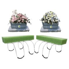 two green benches with flowers in them sitting next to each other on a white background