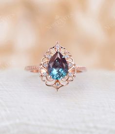 an engagement ring with a blue stone in the center