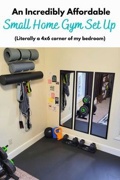 an indoor gym set up with mirrors and exercise equipment on the wall in front of it