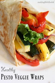 a close up of a tortilla with veggies and peppers on it